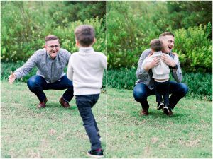 A man crouches with open arms as a young boy runs to him; perfect for a Solana Beach maternity session.
