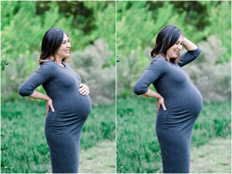 A pregnant woman in a gray dress stands outdoors, smiling during her Solana Beach pregnancy photos maternity session.