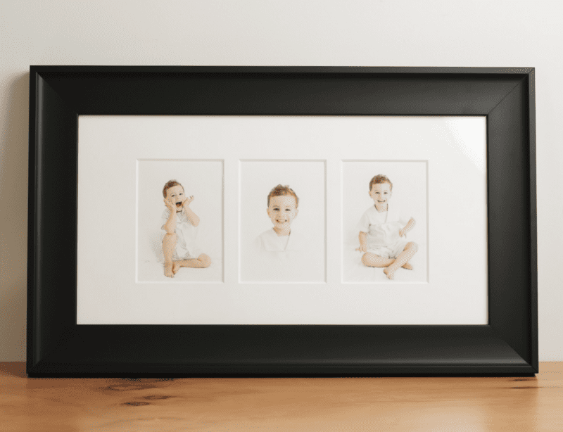 Close-up of framed torn edge trio artwork from motherhood mini session