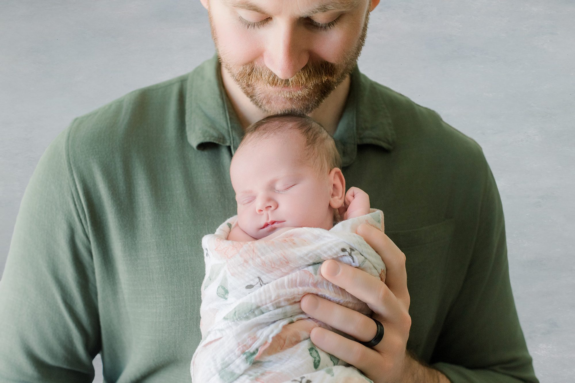 peaceful baby sleeping with father